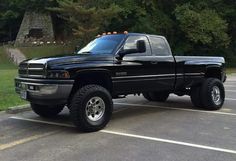 a black pickup truck parked in a parking lot