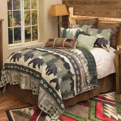 a bed in a bedroom with an animal themed comforter and pillows on the bed