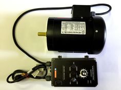 an electric motor and charger on a white surface