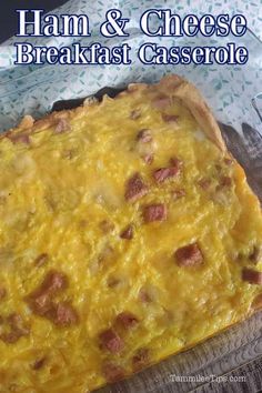 ham and cheese breakfast casserole in a glass dish on a wooden table with text overlay