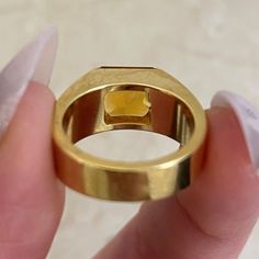 This unique ring features a natural citrine stone in a square cut. This ring is handcrafted in 18k yellow gold and signed by Cartier.
The approximate measurements of the citrine are 8.06mm x 7.92mm x 5.50mm.
This ring is currently sized at 5 and can be resized at no additional cost.
Ready to Make It Yours? Contact us to reserve this ring and to get more info! Luxury Yellow Square Cut Rings, Luxury Citrine Topaz Ring With Emerald Cut, Luxury Gold Topaz Ring With Polished Finish, Luxury Yellow Gold Asscher Cut Sapphire Ring, Modern Gold Rectangular Topaz Ring, Modern Gold Topaz Ring In Rectangular Shape, Gold Sapphire Ring With Rectangular Shape For Formal Events, Gold Rectangular Sapphire Ring For Formal Occasions, Rectangular Sapphire Ring In Gold For Formal Occasions