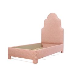 a pink bed with an arched headboard and foot board on top of the frame