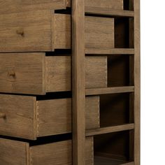 a wooden dresser with several drawers and shelves