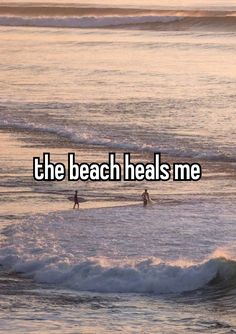 the beach heals me with two surfers in the water