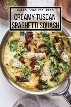 creamy tuscann spaghetti with spinach and cheese in a skillet