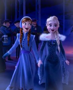 two frozen princesses are walking together in the snow