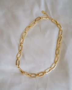 Add bold modern style to your look with the Parker Chunky Chain Choker! This intricate necklace gives any look a contemporary edge with its statement making chain design and stylishly chunky shape! NECKLACE FEATURES Material: Brass Finish: 24K Gold Filled or Rhodium (silver) Paperclip Chain Lead Free & Nickel Free Chain measures 16" with a 2" chain extender. Intricate Necklace, 24 Karat Gold, Freshwater Pearls Earrings, Chain Extenders, Chain Design, Pretty Earrings, Moonstone Ring, Opal Necklace, Chain Choker