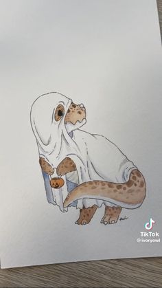 a drawing of a lizard wrapped in a blanket