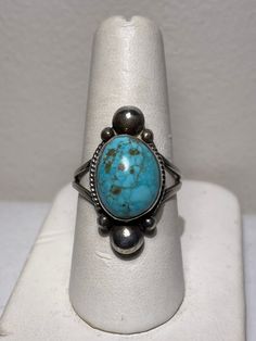 Beautiful large cabochon turquoise ring set in sterling silver by artist Cortez H. This ring is a size 7.25 Southwestern Turquoise Ring With Oval Cabochon, Southwestern Oval Cabochon Turquoise Ring, Southwestern Turquoise Oval Cabochon Ring, Collectible Turquoise Cabochon Ring, Southwestern Turquoise Cabochon Rings, Unique Sterling Silver Turquoise Cabochon Ring, Southwestern Style Cabochon Rings, Collectible, Collectible Silver Turquoise Cabochon Ring, Southwestern Style Cabochon Ring Collectible