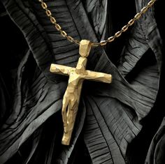 This modern crucifix necklace is a beautiful and elegant way to express your faith. The crucifix is made of genuine 18k or 14k gold and features a stylized design with a facetted surface. The cross is suspended from a sturdy Forzatina chain, which is made of solid gold. This necklace is perfect for any occasion, whether you're looking for a gift for a special occasion or just want to add a touch of elegance to your everyday look. It's also a great way to show your love for your faith. 🔆 Product