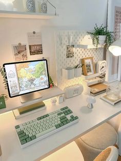 a white desk with a computer on it