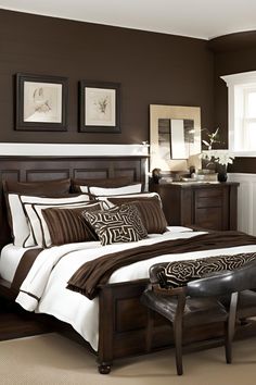 a bedroom with brown walls and white bedding