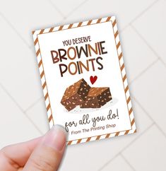 someone holding up a brownie point card with the words you describe brownie points for all you do