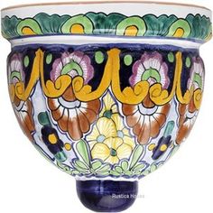 an ornately painted bowl with flowers on it