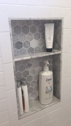 the bathroom is clean and ready to be used for someone's personal care products