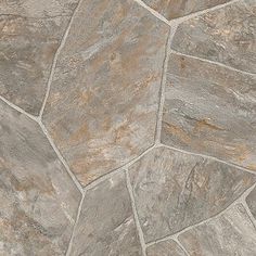 a close up view of a stone floor with grey and brown colors on the surface