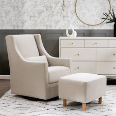 a white chair and ottoman in a room