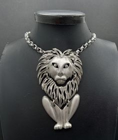 Vintage Lion Pendant Necklace 1960's 1970's Measurements Length - 20 inches Pendant measurements Height - 3 3/4 inches Width - 2 1/8 inches In very good vintage condition. A nice addition to any collection. PS18 Vintage Nickel-free Necklace For Party, Handmade Vintage Chain Necklace, Vintage Handmade Metal Chain Necklace, Handmade Vintage Metal Chain Necklace, Retro Style Necklace With Large Pendant, Mid-century Metal Jewelry For Gifts, Mid-century Metal Jewelry Gift, Retro Metal Necklaces With Large Pendant, Retro Metal Necklace With Large Pendant