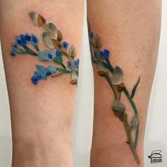 two tattoos that have blue flowers on them