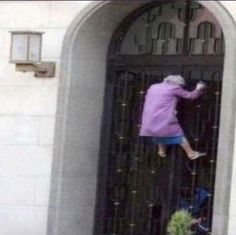 an old woman is jumping into the door