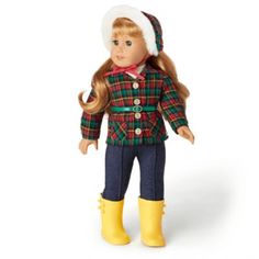 a doll with long hair wearing a green and red plaid jacket, yellow boots and a white hat