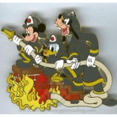 mickey mouse fire fighters on top of a fire hydrant with their arms around each other