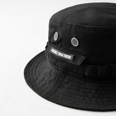 Introducing Bucket Hat Techwear, the perfect combination of function and fashion. This stylish hat is made from high-tech materials that provide superior sun protection and an extra layer of warmth. Ideal for women who love to stay active outdoors, Bucket Hat Techwear is perfect for hiking, camping, or any outdoor activity. The hat's generous brim provides excellent coverage from the sun, while the lightweight fabric keeps you cool and comfortable all day long. The hat's adjustable strap ensures Womens Techwear, Techwear Outfits, Black Bucket Hat, High Street Shops, Futuristic Style, Mens Bucket Hats, Black Bucket, Fashion Cap, Fashion Cover