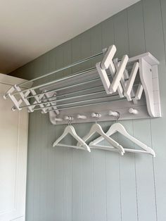 a coat rack with clothes hanging on it