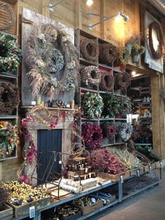 a store filled with lots of different types of wreaths