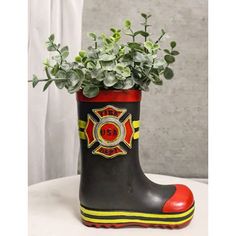 a pair of rubber boots with flowers in them