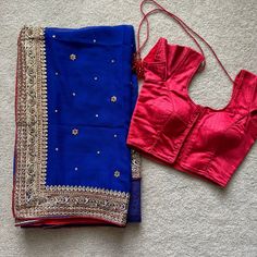 Beautiful Royal Blue With Red And Golden Accent. Comes As A 2-Piece Outfit (Saree And Blouse) Brand New, Never Worn! No Tags. Originally From India, Made Of High Quality Fabric And Stitching. Style: Saree Sari: - Sizing: One-Size Fits All Blouse: - Rib Cage: 12" - Blouse Length: 13" - Sleeve Length: 4.5" - Sleeve Opening: 5" - Extra Margin: ~1.5 Inches On Both Sides - Fish And Eye Hooks In The Front For Easy Closure - High Quality Padding/Cups - Strings In The Back For A More Fitted Look Sarees Blue Fitted Pre-draped Saree, Blue Fitted Pre-draped Saree With Self Design, Fitted Royal Blue Saree For Festive Occasions, Semi-stitched Royal Blue Saree, Royal Blue Fitted Saree With Unstitched Blouse, Royal Blue Blouse For Diwali, Royal Blue Blouse Piece For Diwali, Festive Blue Fitted Pre-draped Saree, Fitted Blue Saree For Festivals