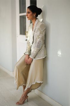 A slate coloured tissue jacket with folded lapels is rendered with intricate cutwork and thread and embroidery. Paired with ivory choli and slate-coloured charmeuse box trousers with embroidered hems; this outfit exudes sheer elegance. Model Height is 5'6 jacket length is 26" Website Features, How To Dye Fabric, Cut Work, Online Branding, Western Wear, Model Height, Creative Ideas, Fashion Dresses, Thread