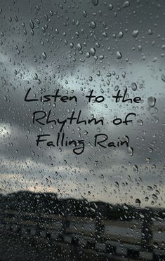 rain drops on a window with the words listen to the rhythm of falling rain