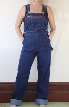 Vintage 1990s dark wash long overalls.  In excellent vintage condition  Fabric: Cotton   Size: 10 Australian  Measurements  Length: 160cm (adjustable) Waist: 78cm Hips: 94cm Rise: 34cm Postage Standard postage $10.00 or Express postage within Australia $13.00. DM for a quote on combined postage, international buyers please email for a quote if postage costs are not specified. Retro Dark Wash Denim Jumpsuit, Retro Dark Wash Bib Front Overalls, Dark Wash Full-length Overalls With Pockets, Dark Wash Full Length Overalls With Pockets, Vintage Dark Wash Bib Front Overalls, Vintage Dark Wash Overalls With Pockets, Vintage Dark Wash Denim Jumpsuit With Straight Leg, Vintage Dark Wash Straight Leg Denim Jumpsuit, Long Overalls