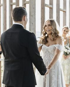 the bride and groom are smiling at each other