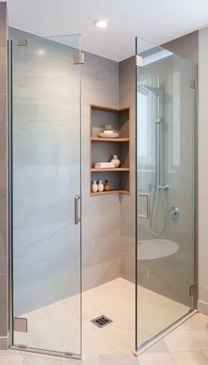 a walk in shower sitting inside of a bathroom