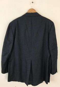 "-Description- >men's dark gray sport coat with light blue pinstripes >two button front >two buttons on the cuffs >three open pockets on the front >vent in the back >partially lined >size 46 >awesome 70s sport coat! >condition: great >color(s): gray, blue >fabric(s): wool >brand: majer >care: dry clean -Measurements- >size: 46 ✩ all measurements are taken with the item laying flat & some sizes are estimates so please check measurements ✩ chest: 46\" Semi-formal Pinstripe Sport Coat With Long Sleeves, Pinstripe Long Sleeve Sport Coat For Semi-formal Occasions, Pinstripe Single Breasted Long Sleeve Sport Coat, Pinstripe Single-breasted Long Sleeve Sport Coat, Long Sleeve Pinstripe Single Breasted Sport Coat, Semi-formal Striped Long Sleeve Sport Coat, Business Striped Sport Coat With Welt Pockets, Striped Sport Coat With Welt Pockets For Business, Grey Sport Coat