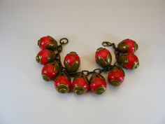 Charm, bracelet, armlet, brass bracelet, red bracelet, hude beads,  floral, arm jewelry, floral beads, gift, wife, girlfriend, birthday  --------------------------- A beautiful red beads with brass beads caps and chain vintage bracelet..It is approx. 7 ½ " (19cm) lenght. It is in very good vintage condition.  For adult use only - embellishments may have small or pointy parts. Actual colors may slightly vary from those shown due to the nature of photographing and monitor color settings. More phot Red Costume Jewelry Bracelets As Gift, Brass Bracelets With Round Beads For Gifts, Brass Bracelets With Round Beads As Gift, Vintage Red Bracelet As A Gift, Vintage Red Bracelet For Gifts, Unique Red Bracelet For Gift, Red Bohemian Flower Beaded Bracelets, Red Flower-shaped Bohemian Beaded Bracelets, Vintage Red Adjustable Beaded Bracelets