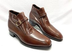 RARE FIND. BRAND NEW WITH SHOE TREES. EXCELLENT CONDITION. THIS IS A HIGH QUALITY PAIR OF 70's FINE WHISKEY BROWN LEATHER FLORSHEIM IMPERIAL BOOTS. VERY HANDSOME MOD 60's FLOWER CHILD GUARDSMEN HIPSTER ANKLE BOOTS.  HAS THE GREEN AND SILVER EMBROIDERED FLORSHEIM LOGO PATCH SEWN INTO THE ALL LEATHER LINING AND GOLD IMPERIAL FLORSHEIM SIGNATURE FOOT BED. THE DARK BROWN LEATHER LINING HAS GREEN ACCENT STITCHING THROUGHOUT. THEY ARE IN EXCELLENT IMPECCABLY CLEAN CONDITION AS SHOWN IN THE PICTURES.  ALL LEATHER SOLES AND SIGNATURE FLORSHEIM HEEL CAPS.  MENS SIZE READS 9.5D. THEY HAVE ADJUSTABLE HARNESS STRAPS WITH ANTIQUED BRASS BUCKLES.  THE FLAP UNDER THE STRAPS HAS 2 ELASTIC INSERTS FOR ADDED COMFORT AND STRETCH WHEN PUTTING ON, TAKING OFF AND BEING WORN.    THEY HAVE A DARK BROWN SMOOTH LEA Vintage Brown Snip Toe Boots With Leather Sole, Brown Vintage Boots With Waxed Finish, Vintage Brown Oiled Leather Work Boots, Rustic Vintage Brown Snip Toe Boots, Florsheim Imperial, Vintage Brown Leather Mid-calf Boots, Logo Hipster, Beatle Boots, Silver Logo