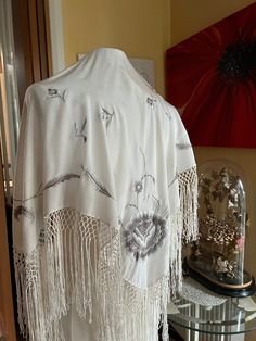 A lovely silk crepe shawl with machine embroidered flowers and leaves in shades of gray. In excellent clean laundered condition  Measures  30" plus 8" of drinks he Luxury Embroidered Wedding Shawl, White Silk Pashmina Shawl, Embroidered Silk Scarf Shawl For Wedding, Embroidered Silk Shawl For Wedding, Embroidered Silk Shawl Scarf, White Silk Shawl Scarf, One Size, Embroidered Silk Shawl, Shades Of Gray, Silk Shawl