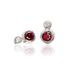 Cluster bezel set ruby and diamond stud earrings for everyday wear. Rubies and diamonds are set in a full bezel setting. The bezels are finished with a polished finish (satin brushed finish upon request). The earrings can be ordered with your choice of a 3mm ruby and 1.5mm diamond or in the larger version with 4mm diameter ruby and 2mm diamond. It's available either with a lab created Chatham Ruby or a genuine ruby. Ruby Spec: Size/Weight: 3mm/0.15ct or 4mm/0.35ct each Shape: full cut round face Flush Set Diamond, Rubies And Diamonds, Bezel Set Earrings, White Gold Earrings Studs, White Gold Studs, Bar Stud Earrings, Set Earrings, Circle Pendant Necklace, Circle Earrings Studs