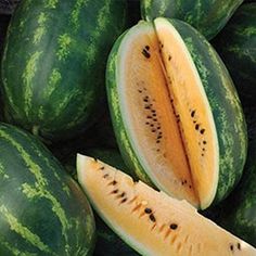 a pile of watermelon cut in half