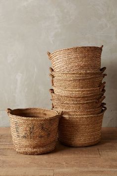 several woven baskets stacked on top of each other