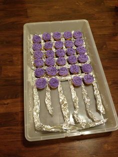 cupcakes are arranged in the shape of an american flag on top of foil