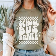 This School Bus Driver Shirt is a retro bus driver t-shirt, perfect for the school transportation squad. Ideal as a school staff gift, this bus driver shirt captures the school vibe and unites the bus team. Unisex Jersey Tee- Soft cotton, lightweight, breathable, and easy to layer 🎀 Ash 99% cotton/1% polyester, Heather Blends 52% cotton/48% polyester, Athletic Heather 90% cotton/10% polyester  🎀 100% Airlume combed and ring-spun cotton  🎀 Crew neckline, tear-away label avoids skin irritations Bus Driver Shirt Ideas, Retro Crew Neck T-shirt For School, Retro School T-shirt With Text Print, Retro Letter Print T-shirt For School, Retro Crew Neck T-shirt For Back To School, Retro Text Print T-shirt For School, Retro Short Sleeve School T-shirt, Retro Short Sleeve T-shirt For School, Holiday Shirt Ideas