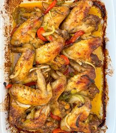 chicken with peppers and onions in a casserole dish, ready to be eaten