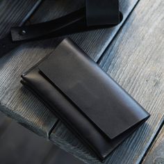 Flap front wallet with reliable magnetic closure 100% Real Leather High quality YKK zipper INTERIOR FEATURES 1 slip pocket for cards 2 large slip pockets for receipts,cash or cards. EXTERIOR FEATURES Back zip pocket. Available in two sizes: S | 10x17cm M | 10x18.5cm ALL WALLETS| https://www.etsy.com/shop/ereretsy?ref=l2-shopheader-name§ion_id=23359465 Choose extra shipping | https://www.etsy.com/listing/1042752819/express-shipping-via-ups?ref=shop_home_active_109 Business Trifold Wallet With Cell Phone Pocket, Black Business Wallet With Cell Phone Pocket, Everyday Black Wallets With Cell Phone Pocket, Black Wallet For Daily Use, Modern Black Wallet With Cell Phone Pocket, Black Envelope Wallet For Daily Use, Black Wallet With Flat Pocket, Black Rectangular Wallet With Pockets, Black Rectangular Wallets With Pockets