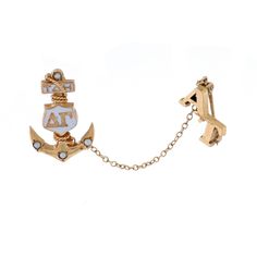 a pair of earrings with an anchor and letters on the front, attached to a chain