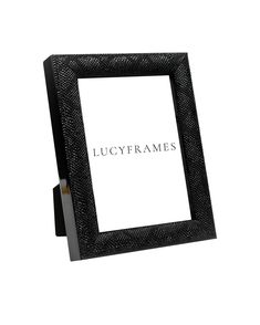 a black frame with the words lucyframes written in silver foil on it