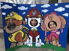 a cardboard cutout of two dogs and a fireman in front of a blue background